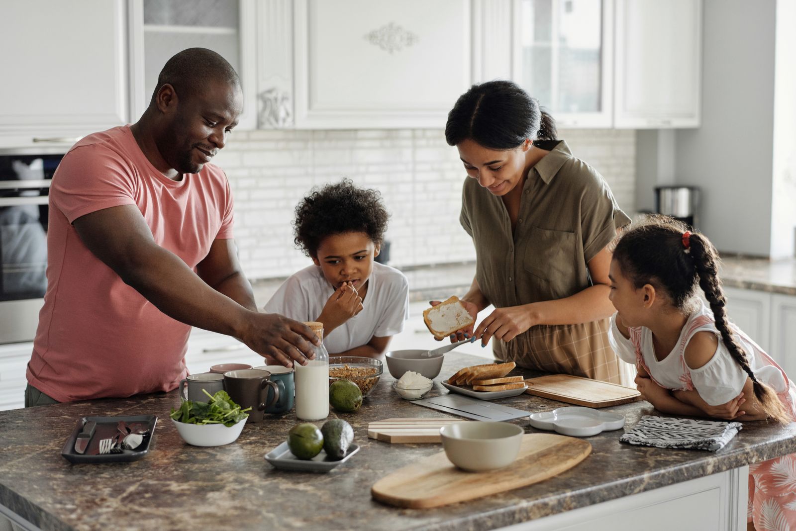 People at a home kitchen counter during a stay