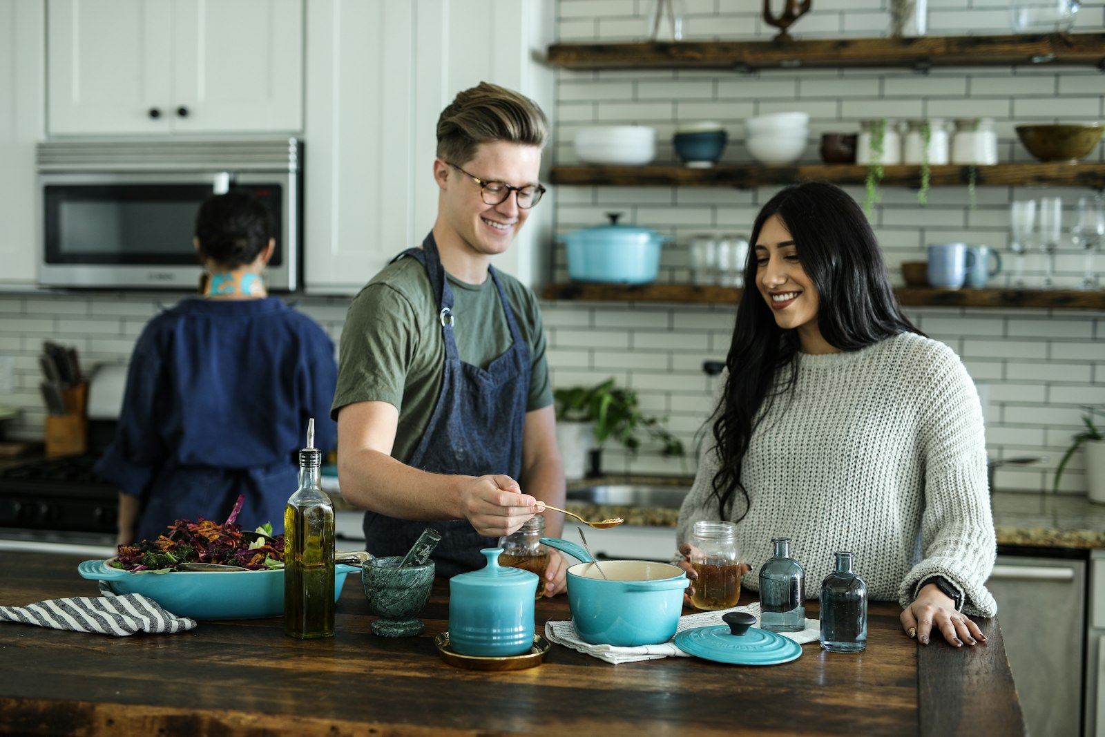 A chef plating dinner in a home kitchen